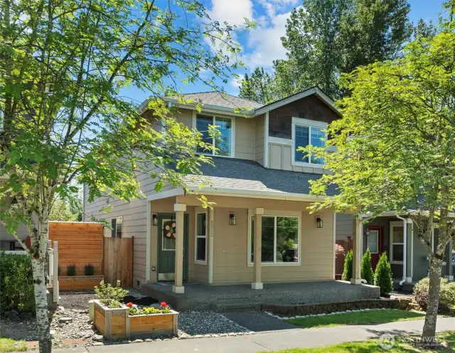 Situated on a peaceful tree lined street w/ covered front patio.