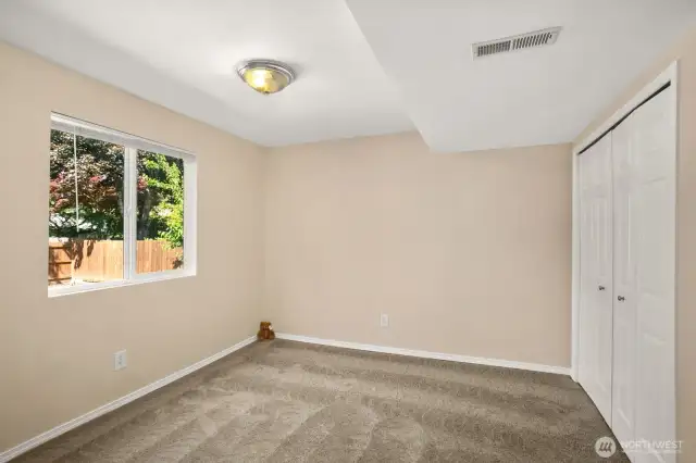 Bright bedroom on lower level with peaceful outlookto back yard
