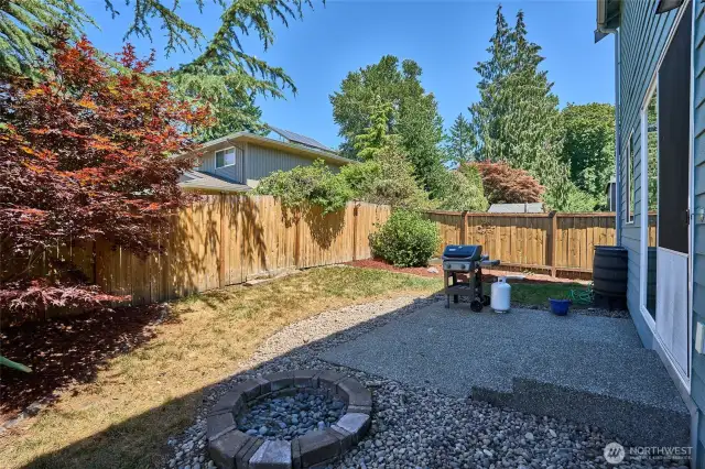 Spacious backyard with fire pit