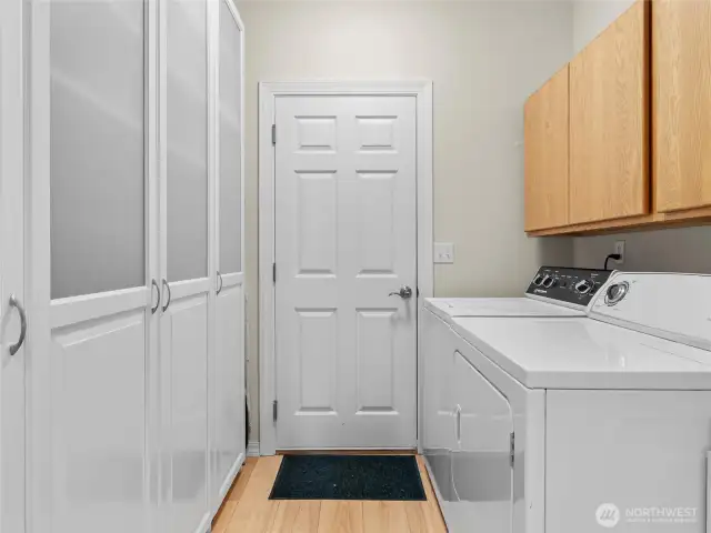 Laundry room with sink and ample storage