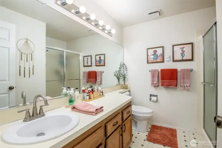Primary bathroom with walk-in shower.