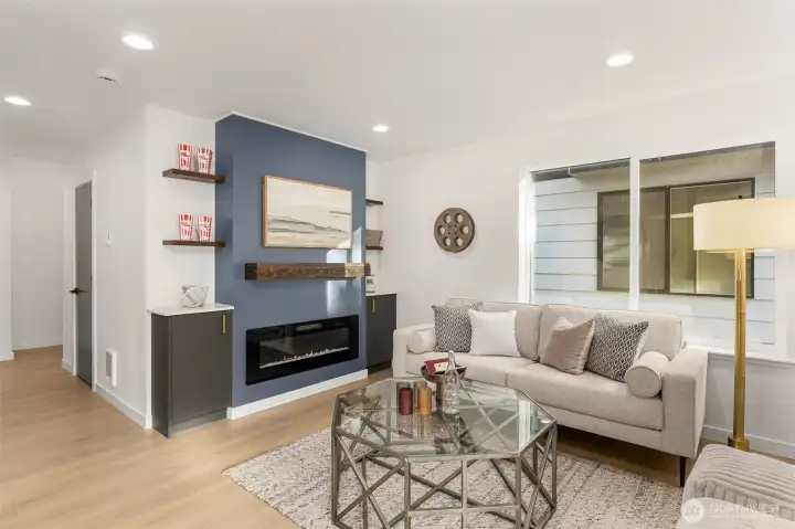 Another fireplaces that offers a cozy focal point surrounded by custom millwork and artful shelving. The layered textures and ambient lighting create a mood of warmth and refinement.