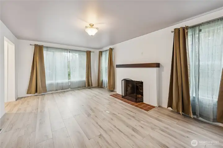Living room with wood-burning fireplace.