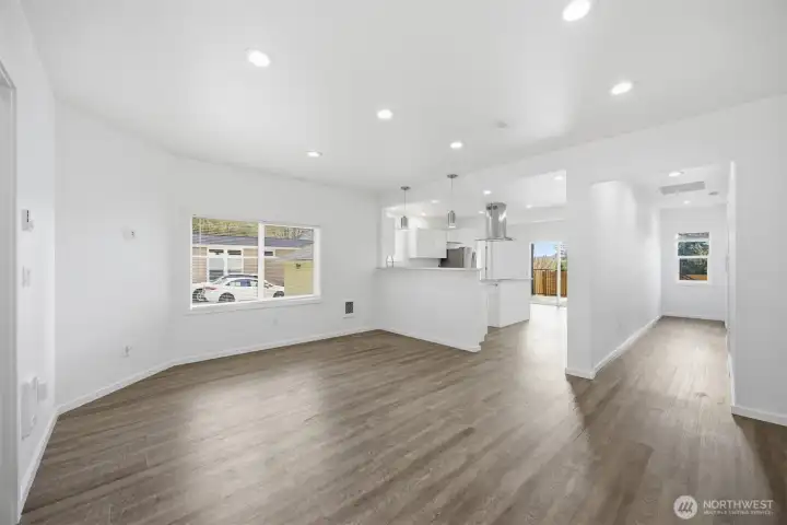 Living room into Kitchen and Hallway towards Guest bed.