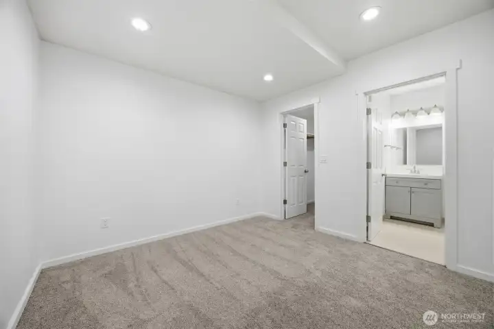 Primary Bed Looking into Bath and walk in closet