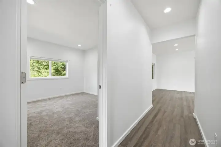 Guest bed looking down the hall to Living room