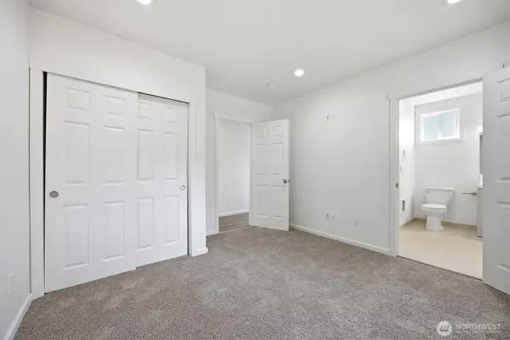Guest bed looking into Second bath.