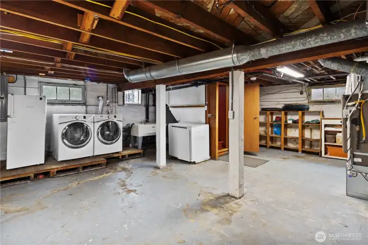Off the kitchen by the breakfast nook are the stairs to the unfinished basement/laundry - easy to finish off for more 'official' living space.