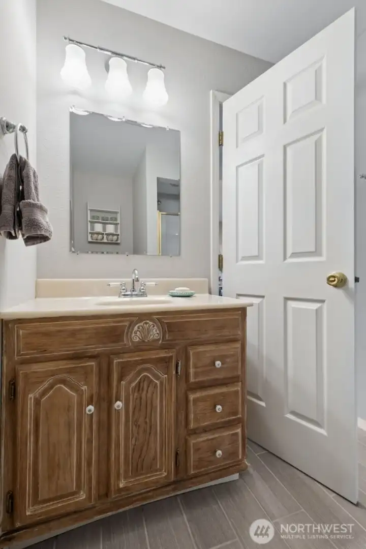 3/4 bath on the lower level is perfect for occupants of the third bedroom, guests when entertaining at the house, working in the garage, and coming in from outside to the lower level - you don't have to walk through the entire house to use a bathroom!