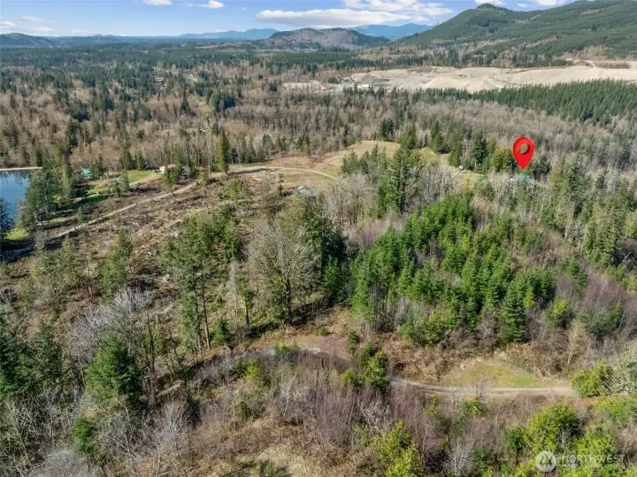 Home has access to a private lake that has 9 adjourning properties. No public access. As you come down the driveway onto the property, you will see a little "trail" sign at the bottom of the hill and that will take you to about 100' of waterfront along the lake that is on this property. While it's pretty simple right now, with a trail down to the water w/some cleared area, it could potentially be made into more.