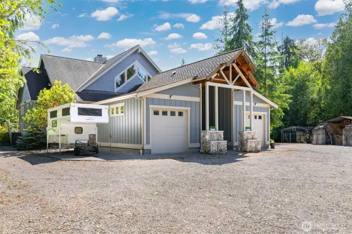 To the side of one of there garages, there is an RV parking space.