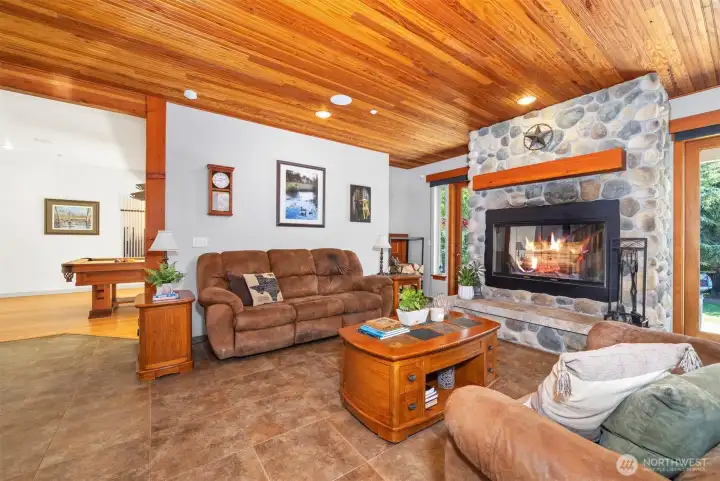 The spacious living area looking toward the pool room.