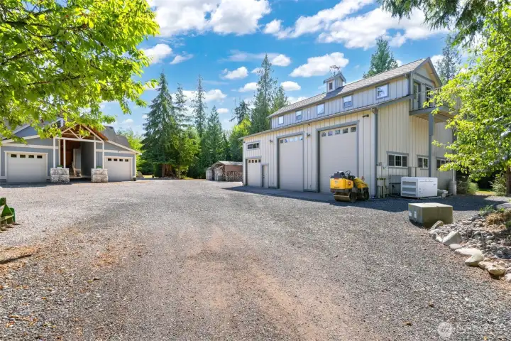 As you approach the home you will see the very large 3 bay shop, with the 30KW generator system to run the home.