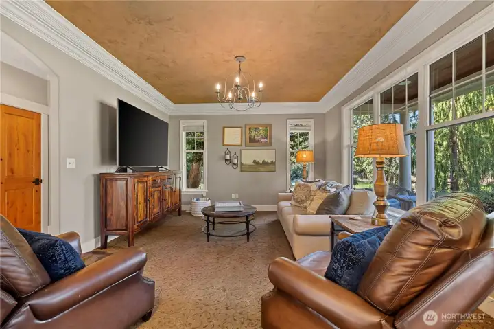 Formal living room has north and west facing garden views.