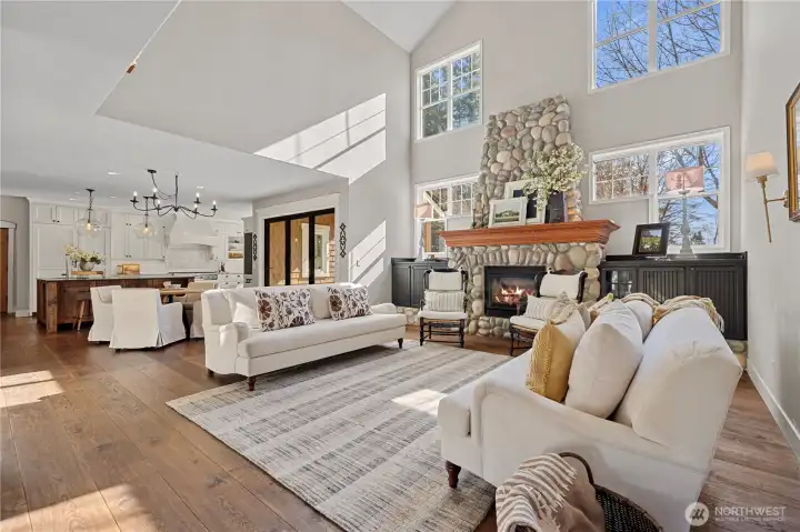 Two-story family room with walls of windows.