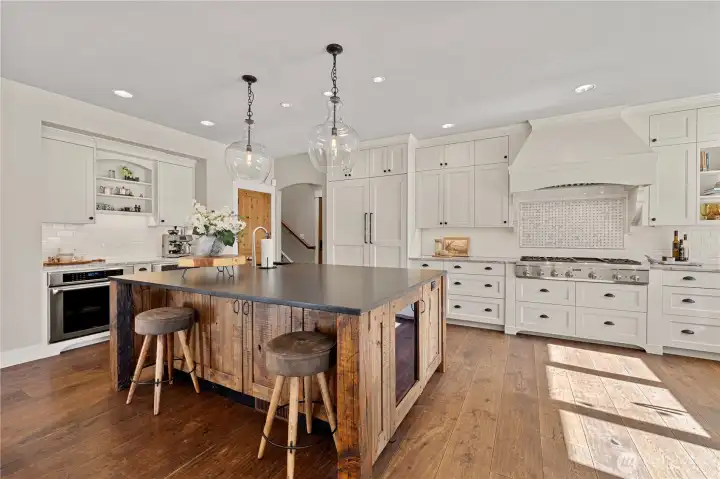 The kitchen island is custom handcrafted with a black pearl granite countertop.