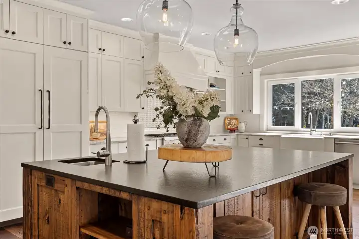 This kitchen has custom cabinets featuring built-in organizers, spice racks... Yes, open them up and look!