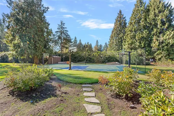 Sport Court and bocce ball court (batting cage potential?). The shed is a perfect place to store the sports equipment.
