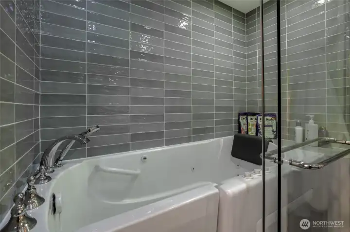 Enclosure with Jetted Walk-in Tub.