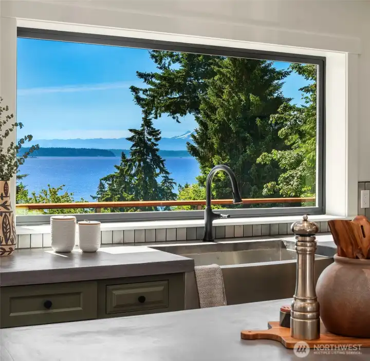 Large farmhouse sink with water and mountain view