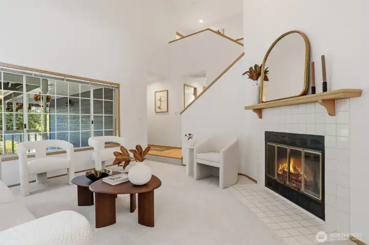 Living Room has wood burning fireplace, new carpet and vaulted ceilings. Living Room has wood burning fireplace, new carpet and vaulted ceilings.