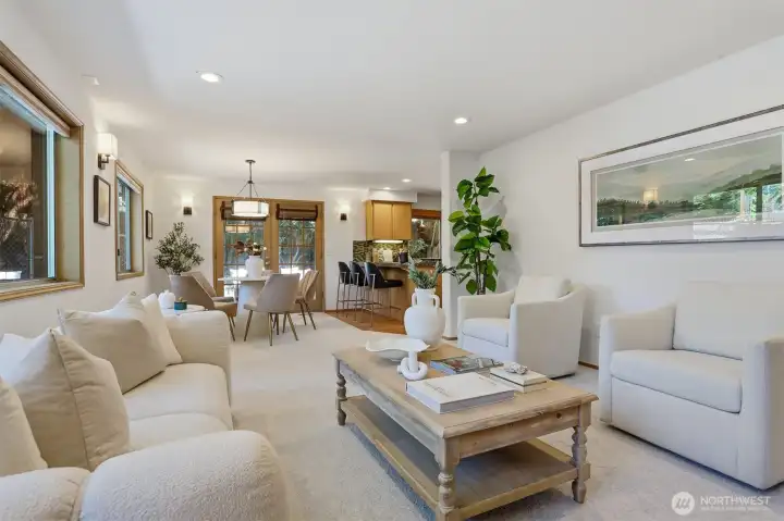 The huge family room off the kitchen offers designer lighting, & fresh carpet & paint. The huge family room off the kitchen offers designer lighting, & fresh carpet & paint.