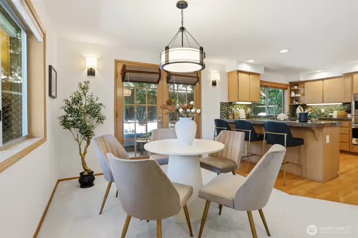 Casual family room eating space with French doors leading to rear deck & yard. Casual family room eating space with French doors leading to rear deck & yard.