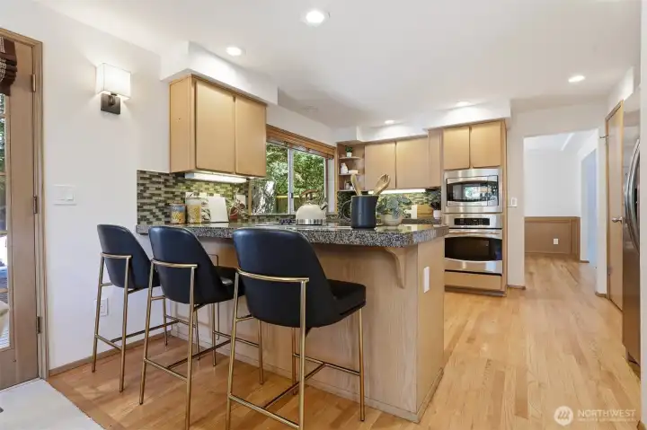 Breakfast bar adjoins the family room to the kitchen. Breakfast bar adjoins the family room to the kitchen.