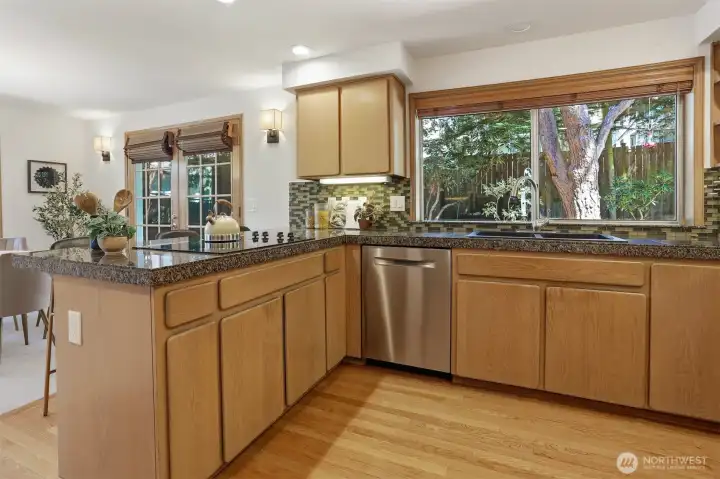 Cook's kitchen looking to casual eating space. Cook's kitchen looking to casual eating space.