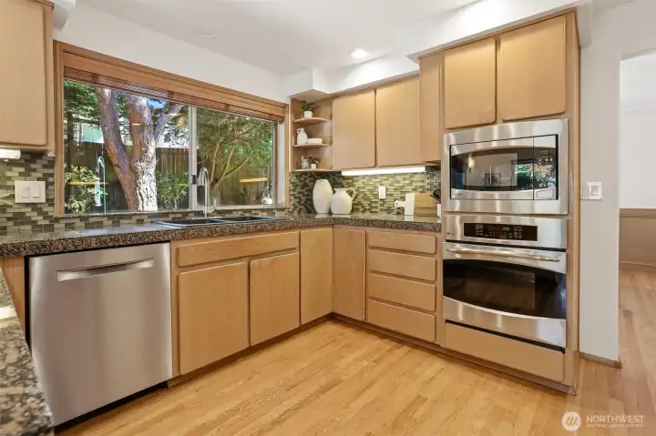 Well appointed kitchen features granite tile counters, glass tile backsplash, pantry & stainless steel appliances. Well appointed kitchen features granite tile counters, glass tile backsplash, pantry & stainless steel appliances.