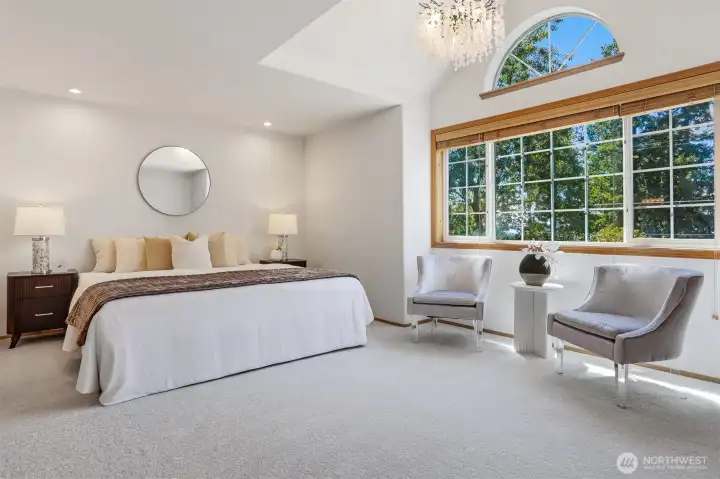 Upper level primary ensuite has wall of West facing windows with peek views to the Olympics & Puget Sound. Upper level primary ensuite has wall of West facing windows with peek views to the Olympics & Puget Sound.