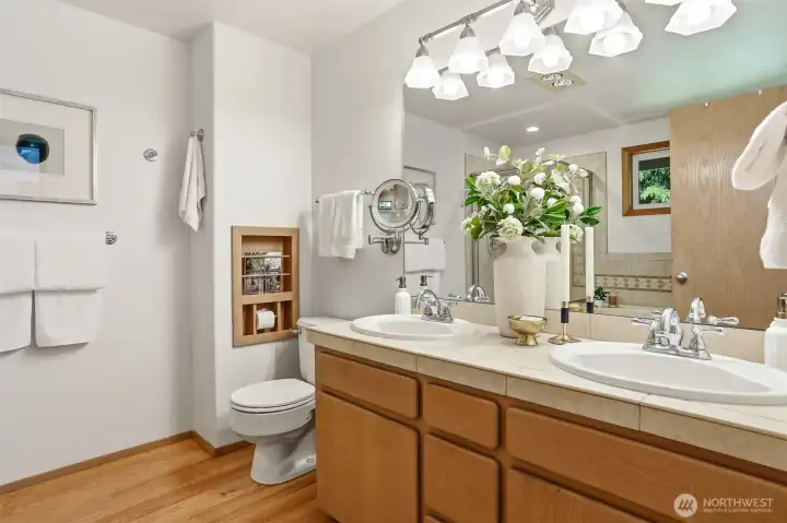 Primary bath has ceramic double vanity sink & hardwood floors. Primary bath has ceramic double vanity sink & hardwood floors.