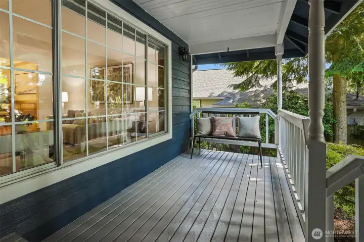 Covered rocking chair porch looking to lush yard and gardens. Covered rocking chair porch looking to lush yard and gardens.