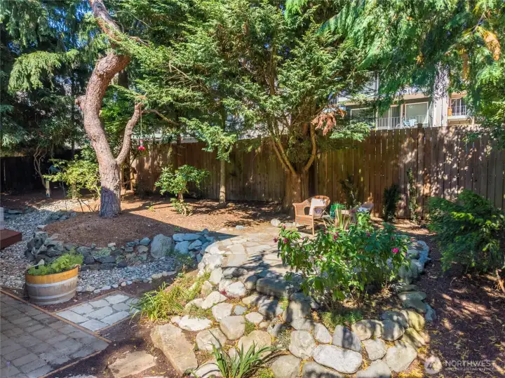 Sunny rear yard & patio space. Sunny rear yard & patio space.