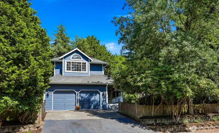 Front view has wide driveway and easy access to two car garage. Front view has wide driveway and easy access to two car garage.