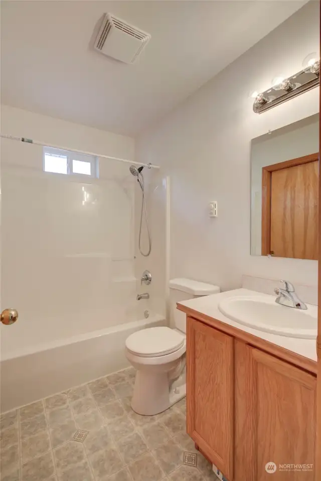 Next down the hall is the main bath for the home.  It can be accessed from both the laundry room and the hallway.