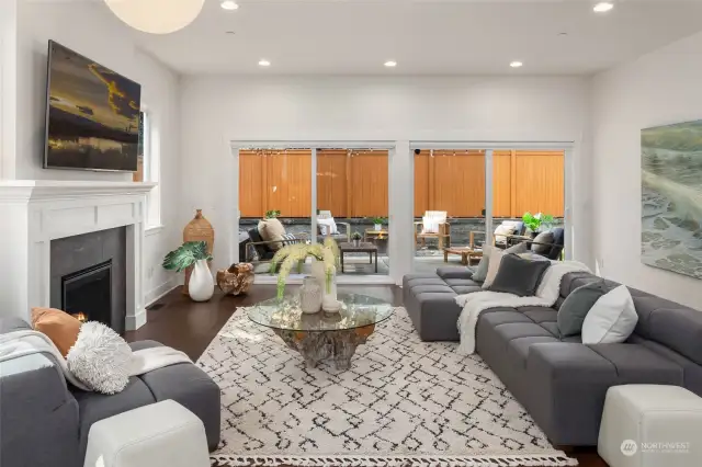 Wide open living room with oversized glass sliding doors inviting the outdoors in!