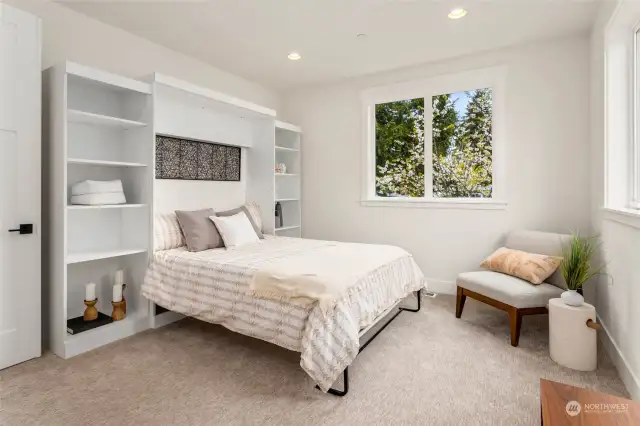 The fourth bedroom has a built-in Murphy bed and plenty of space for a large desk as well, making this space incredibly versatile.  The sellers used this as a work-out room and even had a sauna!