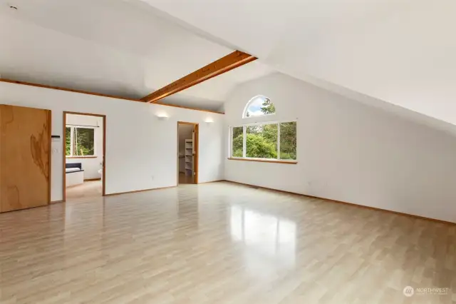 Primary Suite with vaulted ceilings and exposed beams