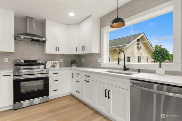 Kitchen complete with soft close cabinets, quartz countertops and S/S appliances