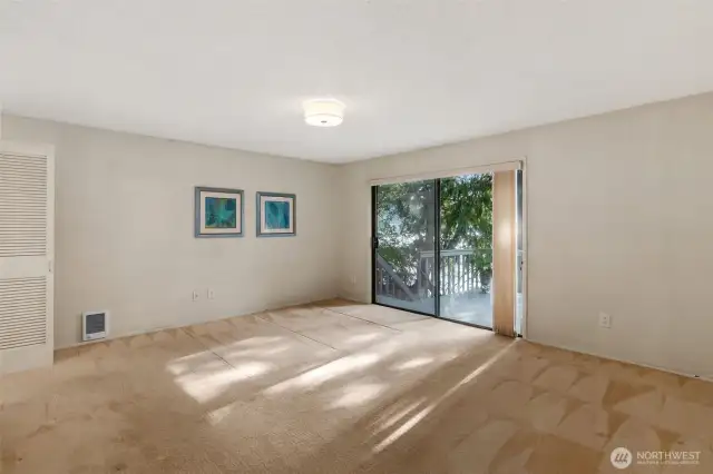 Primary Bedroom with slider to deck overlooking the lake