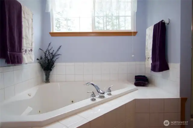 Corner tiled jetted tub is inviting after a long day!
