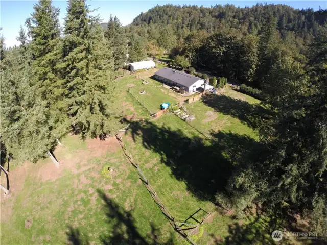 Fully fenced with 6 pastures to rotate livestock, 100x175 outdoor arena, 5-stall barn, loafing shed & a man cave.