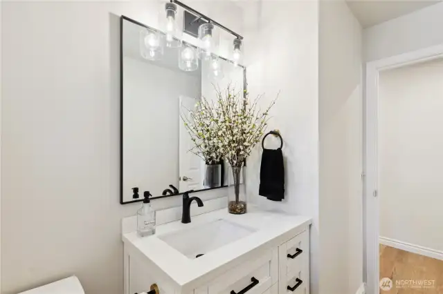 This is a new guest bathroom on the main level just down the hallway on the left.