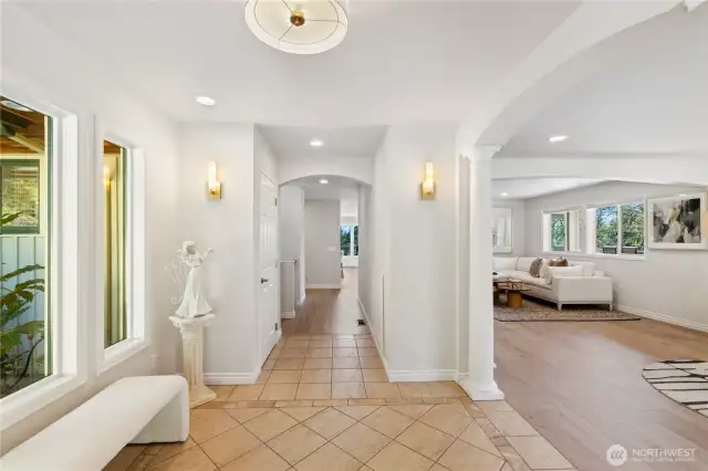 This view is from the double glass front doors.  There's a coat closet down the hallway on the left and a built-in shoe storage cabinet on the right.