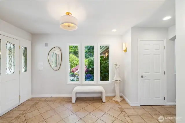The front double door entrance is on the left; there's a large garage and storage room just outside the door.  That window looks out to the Lush Mediterranean Gardens, Water Fountains and Private Sitting areas.