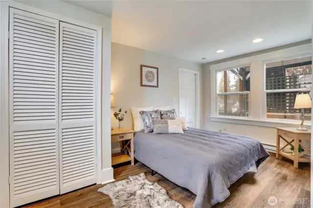 This primary bedroom features new stylish LVP flooring, fresh paint for a move-in-ready feel, and two closets—offering ample storage.