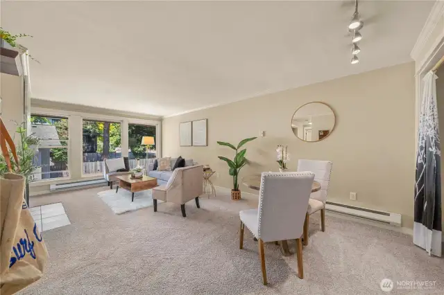 The living and dining areas flow perfectly into each other while offer space for both areas to coexist