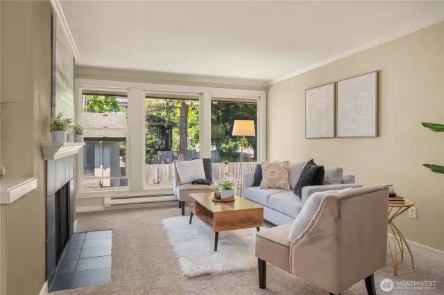 Large windows in the living room fill this home with natural light
