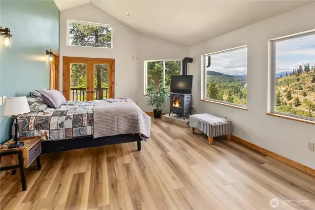 Primary bedroom with private balcony, fireplace and spa-inspired bathroom.